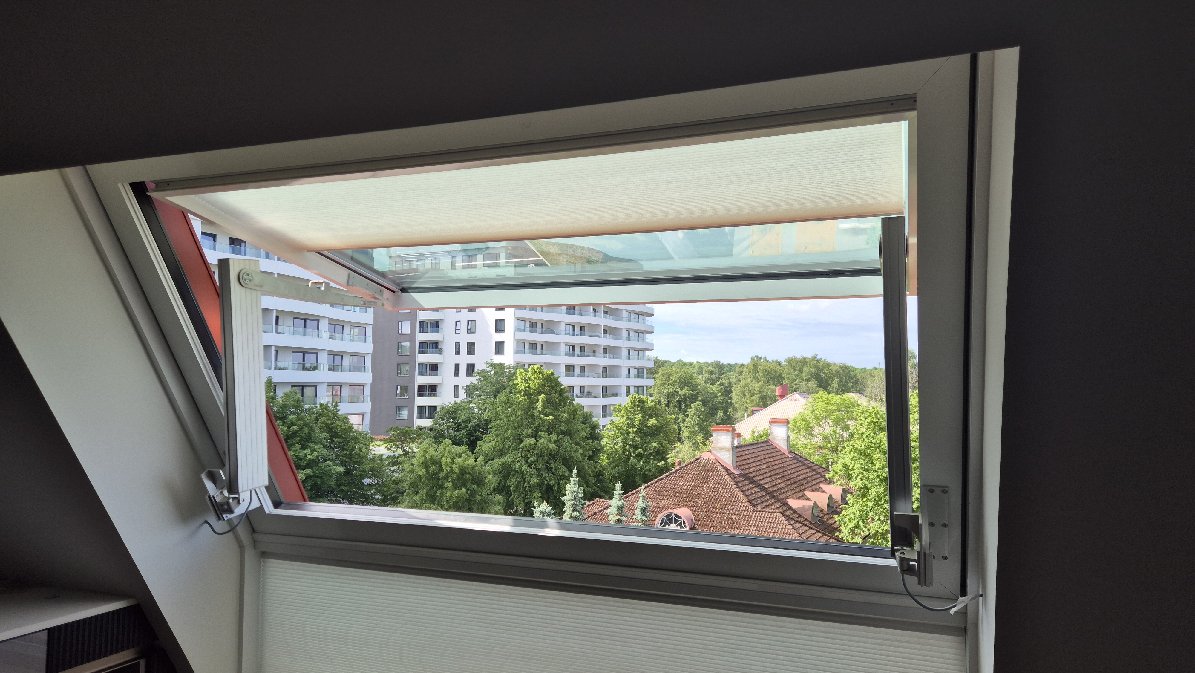 Folding arm hinged window